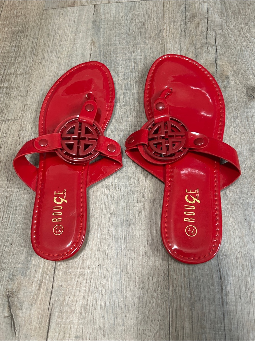 Rouge Helium Red Patent Thong Sandals with Decorative Medallion Accent